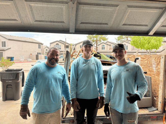 The CNC Junk Removal crew standing in front of their truck