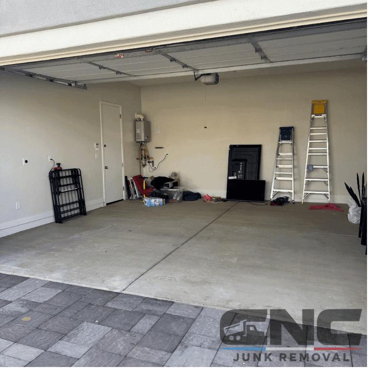 Empty, swept garage with clean concrete floor in Gilbert, AZ